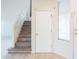Entryway featuring stairs, a door, tile floors and a window with blinds at 231 N Nash Way, Chandler, AZ 85225