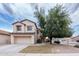 Charming two-story home featuring a well-manicured front yard with a mature shade tree and attached two-car garage at 231 N Nash Way, Chandler, AZ 85225