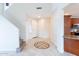 Foyer showcasing a decorative tile inlay, staircase, and access to the kitchen and living areas at 231 N Nash Way, Chandler, AZ 85225