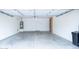 Attached garage featuring clean walls, storage, and a water heater at 231 N Nash Way, Chandler, AZ 85225