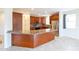 Kitchen showcasing granite countertops, stainless steel appliances, backsplash, and dark stained wood cabinetry at 231 N Nash Way, Chandler, AZ 85225