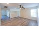 Living room with hardwood floors, trim, and a ceiling fan at 231 N Nash Way, Chandler, AZ 85225