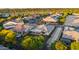 Aerial view of a well-maintained home with a covered patio and lush backyard in a vibrant neighborhood at 3020 N 165Th Ave, Goodyear, AZ 85395