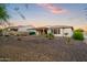 Backyard featuring a covered patio and drought-tolerant desert landscaping at 3020 N 165Th Ave, Goodyear, AZ 85395