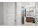 Bright bathroom with tiled shower, wooden vanity, and contemporary fixtures at 3020 N 165Th Ave, Goodyear, AZ 85395