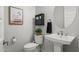 Cozy half bathroom with pedestal sink and decor at 3020 N 165Th Ave, Goodyear, AZ 85395