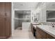 Bathroom featuring double sinks, glass shower and vanity at 3020 N 165Th Ave, Goodyear, AZ 85395