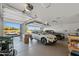 Spacious garage with epoxy floors and three cars at 3020 N 165Th Ave, Goodyear, AZ 85395