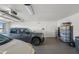 Spacious garage with epoxy floors and two cars at 3020 N 165Th Ave, Goodyear, AZ 85395