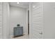 Hallway with a blue accent cabinet and view to a bathroom at 3020 N 165Th Ave, Goodyear, AZ 85395