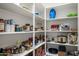 A walk in pantry with stocked shelves and lighting at 3020 N 165Th Ave, Goodyear, AZ 85395