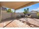 Inviting covered patio with tile flooring and outdoor grill, perfect for entertaining and relaxation at 3027 W Red Fox Rd, Phoenix, AZ 85083