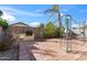 Rear yard with paver patio, built in BBQ, string lights and mature foliage at 3027 W Red Fox Rd, Phoenix, AZ 85083