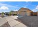 Single Gathering home showing large driveway, desert landscaping, and side gate at 3027 W Red Fox Rd, Phoenix, AZ 85083