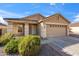 Charming single-Gathering home with a well-maintained front yard, desert landscaping, and a two-car garage at 3027 W Red Fox Rd, Phoenix, AZ 85083