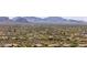 Expansive aerial view of a residential area surrounded by desert landscape and mountains at 30434 N Palo Brea Dr, Scottsdale, AZ 85266
