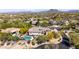 Stunning aerial view showcasing a backyard pool, beautiful landscaping and mountain views at 30434 N Palo Brea Dr, Scottsdale, AZ 85266