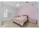 Bright bedroom features carpet, light-blocking shutters, a ceiling fan, and pink walls at 30434 N Palo Brea Dr, Scottsdale, AZ 85266