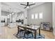 Open-concept dining area with modern table set, seamlessly connected to the kitchen and living space at 30434 N Palo Brea Dr, Scottsdale, AZ 85266