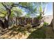 Inviting backyard fire pit area with comfortable seating, perfect for entertaining outdoors in the desert landscape at 30434 N Palo Brea Dr, Scottsdale, AZ 85266