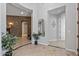 Spacious foyer with tile flooring, high ceilings, and views into other rooms at 30434 N Palo Brea Dr, Scottsdale, AZ 85266