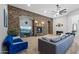 Inviting living room with a stone accent wall, fireplace, and comfortable seating at 30434 N Palo Brea Dr, Scottsdale, AZ 85266