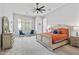 Bright main bedroom features neutral walls, carpet, and a seating area near a large window at 30434 N Palo Brea Dr, Scottsdale, AZ 85266