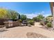 Beautiful outdoor kitchen with built-in grill and ample counter space in a well-maintained outdoor living area at 30434 N Palo Brea Dr, Scottsdale, AZ 85266