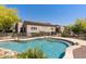 Stunning backyard with a beautiful pool and a safety fence and lush landscaping at 30434 N Palo Brea Dr, Scottsdale, AZ 85266