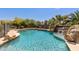 Backyard featuring an inviting pool with rock waterfall and a relaxing atmosphere at 30434 N Palo Brea Dr, Scottsdale, AZ 85266