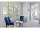 Sitting area in the bedroom featuring two chairs with a small round table at 30434 N Palo Brea Dr, Scottsdale, AZ 85266