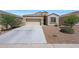 Charming single-story home with a two-car garage and low-maintenance desert landscaping at 31006 W Weldon Ave, Buckeye, AZ 85396