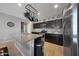 Open kitchen with stainless steel appliances, granite countertops and pot rack above the island at 31006 W Weldon Ave, Buckeye, AZ 85396