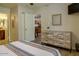 Relaxing bedroom with wood dresser, a queen-size bed, and view to the Kitchen at 3511 E Baseline Rd # 1104, Phoenix, AZ 85042