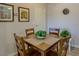 Charming dining area with a wooden table and seating for four at 3511 E Baseline Rd # 1104, Phoenix, AZ 85042