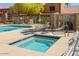 Inviting community hot tub and pool with plenty of seating, perfect for relaxing outdoors at 3511 E Baseline Rd # 1104, Phoenix, AZ 85042