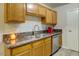 Updated kitchen showcasing granite countertops and stainless steel appliances at 3511 E Baseline Rd # 1104, Phoenix, AZ 85042
