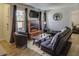 Comfortable living room with a brick fireplace and stylish furnishings at 3511 E Baseline Rd # 1104, Phoenix, AZ 85042