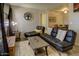 Cozy living room with a fireplace, comfortable seating, and view into the dining area at 3511 E Baseline Rd # 1104, Phoenix, AZ 85042