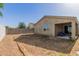 An expansive backyard features block wall fencing, a covered patio and potential for entertaining at 36203 N Urika Dr, San Tan Valley, AZ 85140