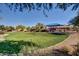 A community park featuring a playground, picnic area and lots of green space for recreation at 36203 N Urika Dr, San Tan Valley, AZ 85140