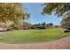 Scenic community park featuring lush greenery and mature trees, ideal for Gathering outings at 36203 N Urika Dr, San Tan Valley, AZ 85140