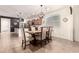 This dining room boasts a decorative light fixture and a charming area for Gathering meals at 36203 N Urika Dr, San Tan Valley, AZ 85140