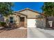 Single-story home with a well-maintained front yard and attached two-car garage at 36203 N Urika Dr, San Tan Valley, AZ 85140