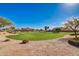 Expansive community greenspace offering lush surroundings and scenic views at 36203 N Urika Dr, San Tan Valley, AZ 85140