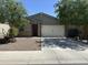Charming single-story home with a two-car garage and low maintenance landscape at 36203 N Urika Dr, San Tan Valley, AZ 85140