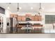 Bright kitchen featuring stainless appliances and generous counter space perfect for cooking at 36203 N Urika Dr, San Tan Valley, AZ 85140