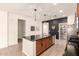 Well-designed kitchen with an island, stainless appliances, and open layout at 36203 N Urika Dr, San Tan Valley, AZ 85140