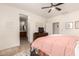 Bright main bedroom featuring comfortable furniture and access to the ensuite bathroom at 36203 N Urika Dr, San Tan Valley, AZ 85140