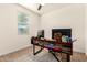 Office features a modern desk with built in book storage and natural light at 36203 N Urika Dr, San Tan Valley, AZ 85140